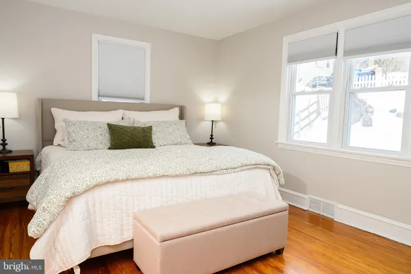 a bedroom with a bed and a lamp