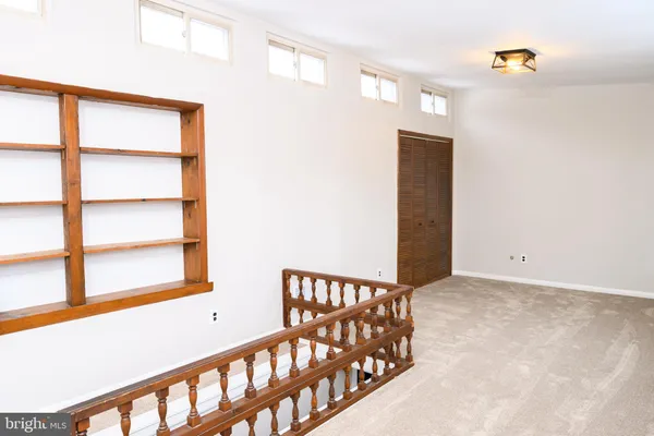 a view of a hallway with staircase