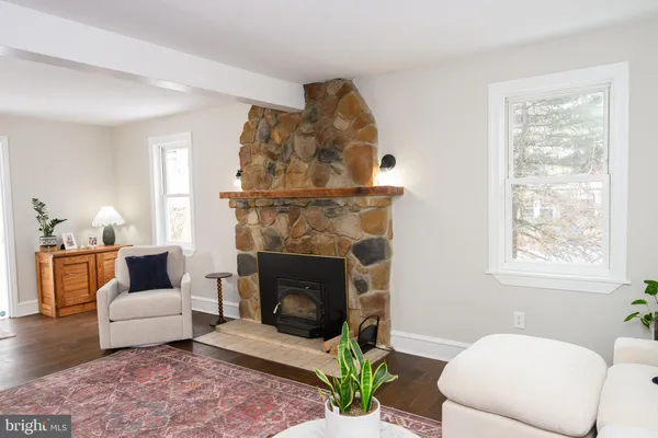 a kitchen with stainless steel appliances a stove a microwave a sink and cabinets