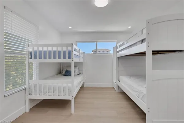 a bedroom with furniture and window