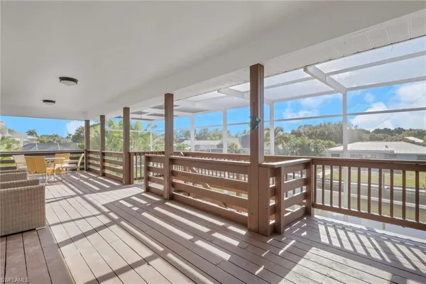 a view of a balcony with wooden floor