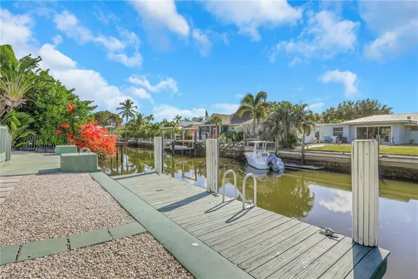 a view of a patio with swimming pool table and chairs