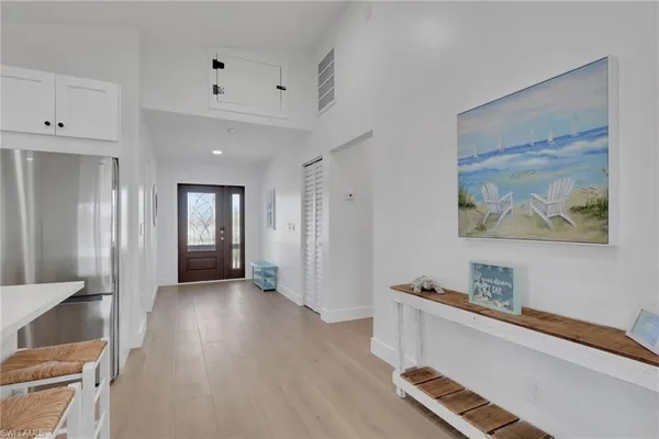 a view of a room with wooden floor and window