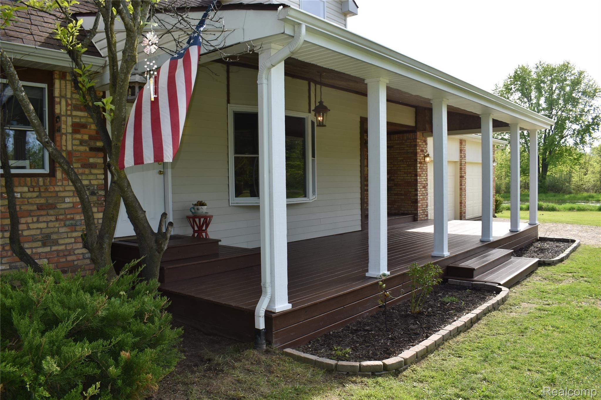 Brimley a front porch.JPG