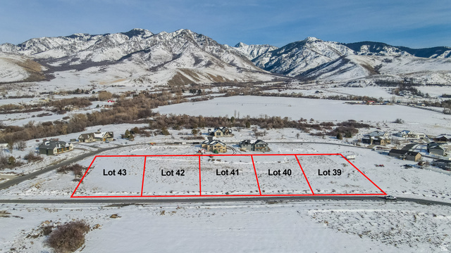 670 Cherry Ridge Lane, Unit 41 Richmond, UT 84333 - Photo 3 of 7 Snowy aerial view with property boundaries highlighted and a mountain view