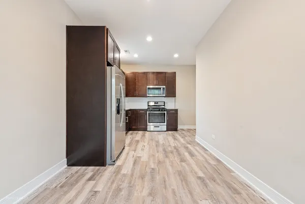 a view of kitchen with wooden floor