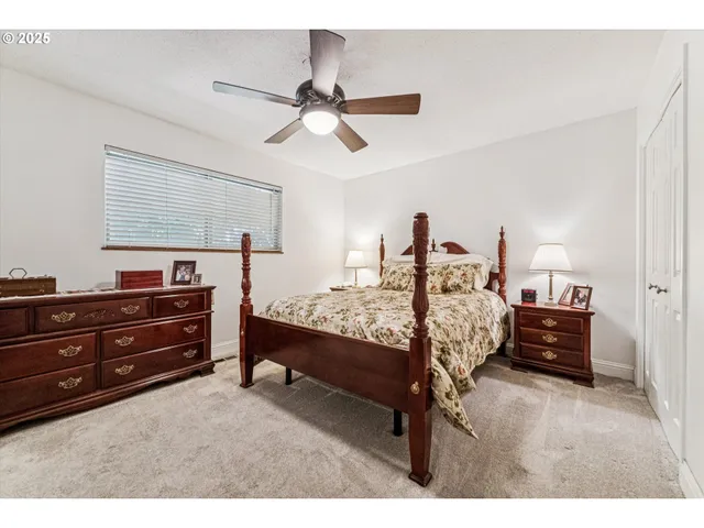 a bed room with bed and window