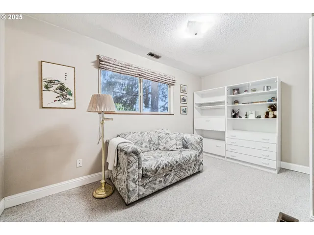 a living room with furniture and window