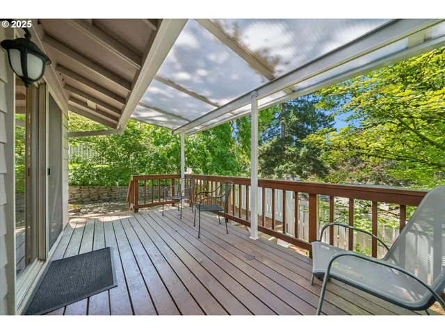 a view of balcony with wooden floor
