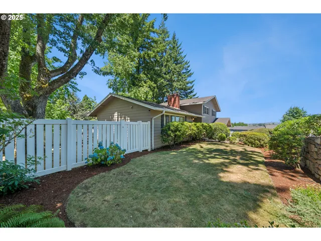 a backyard of a house with lots of green space