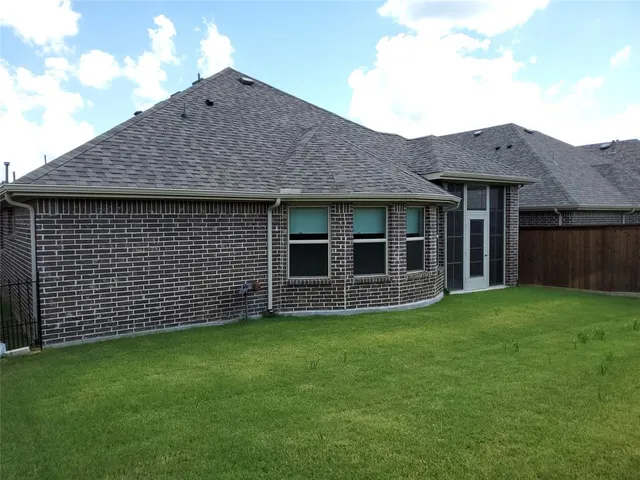 a view of a house with a garden