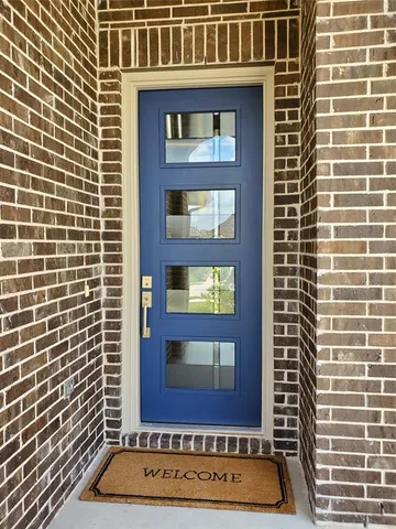 a view of a brick building with a door