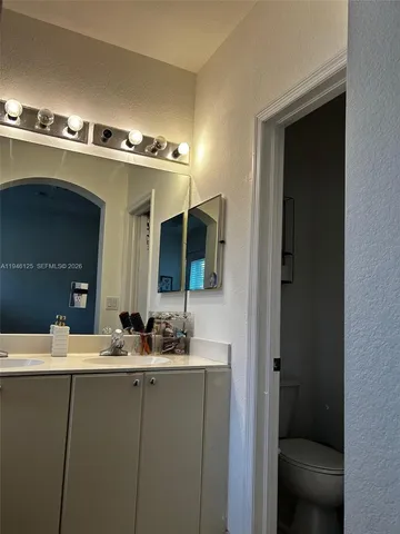 a bathroom with a toilet and shower