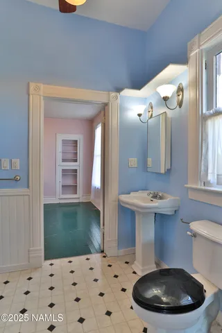 a bathroom with a sink a mirror and shower