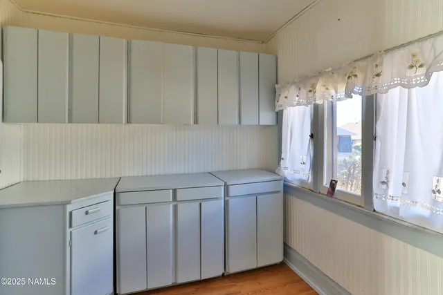 a bathroom with a sink a mirror and a shower