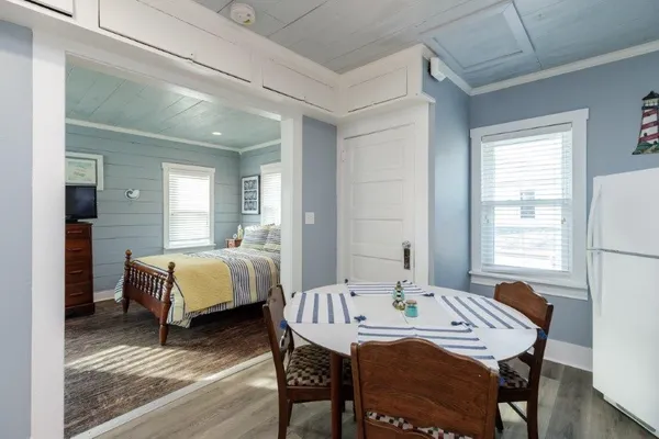 a bedroom with a bed and a desk