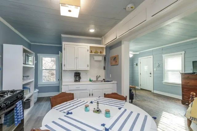 a kitchen with a sink and cabinets