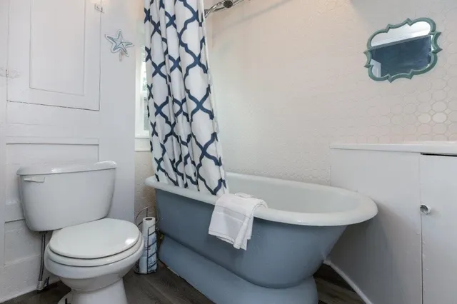 a bathroom with a sink mirror and vanity