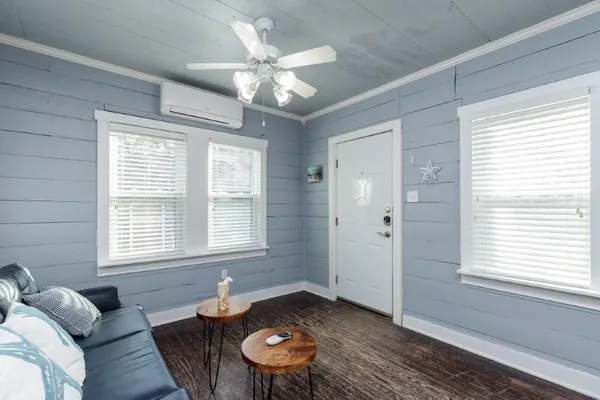 a living room with furniture and a window