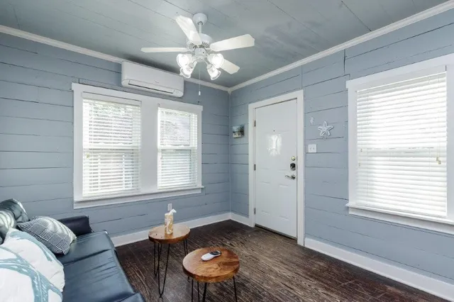 a living room with furniture and a window