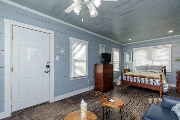 a bed room with furniture and a window