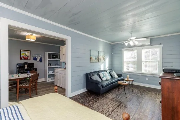a living room with furniture and a window