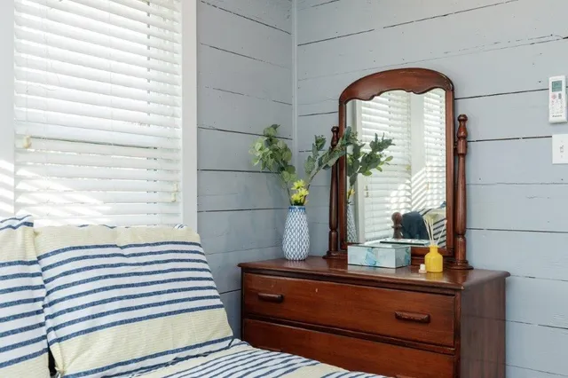 a view of a dining room with furniture and window