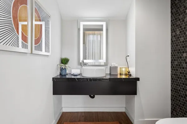 a bathroom with a sink and a mirror