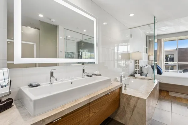 a bathroom with a sink double vanity and a mirror
