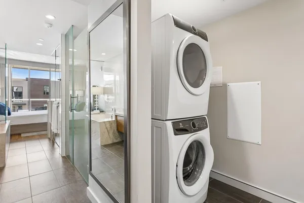 a bathroom with a washer and dryer