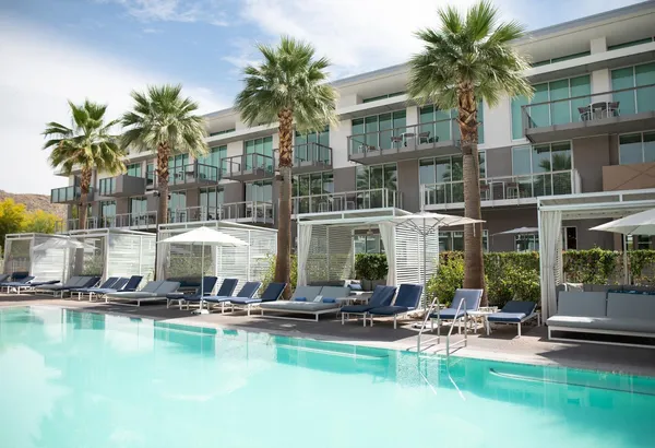 a view of a swimming pool with chairs