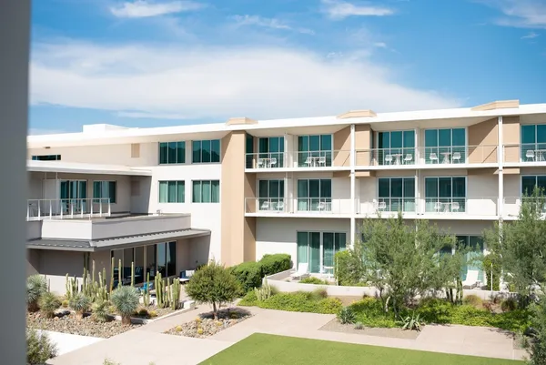 a front view of a building with garden