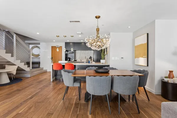 a view of a dining room with furniture and wooden floor
