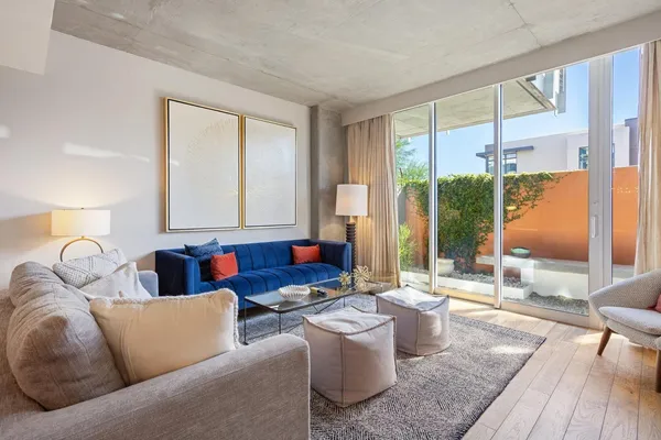 a living room with furniture and a large window