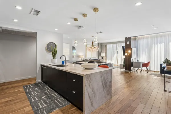 a kitchen with a sink and cabinets