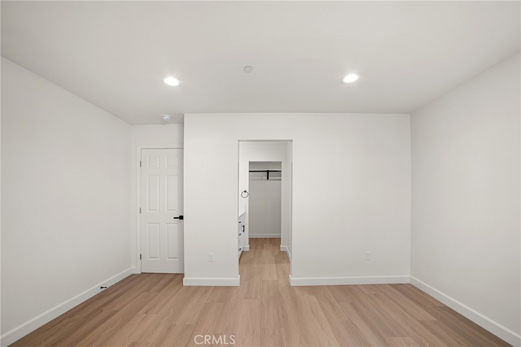 900 South Hert Street Colton, CA 92324 - Photo 11 of 26 wooden floor in an empty room with a window