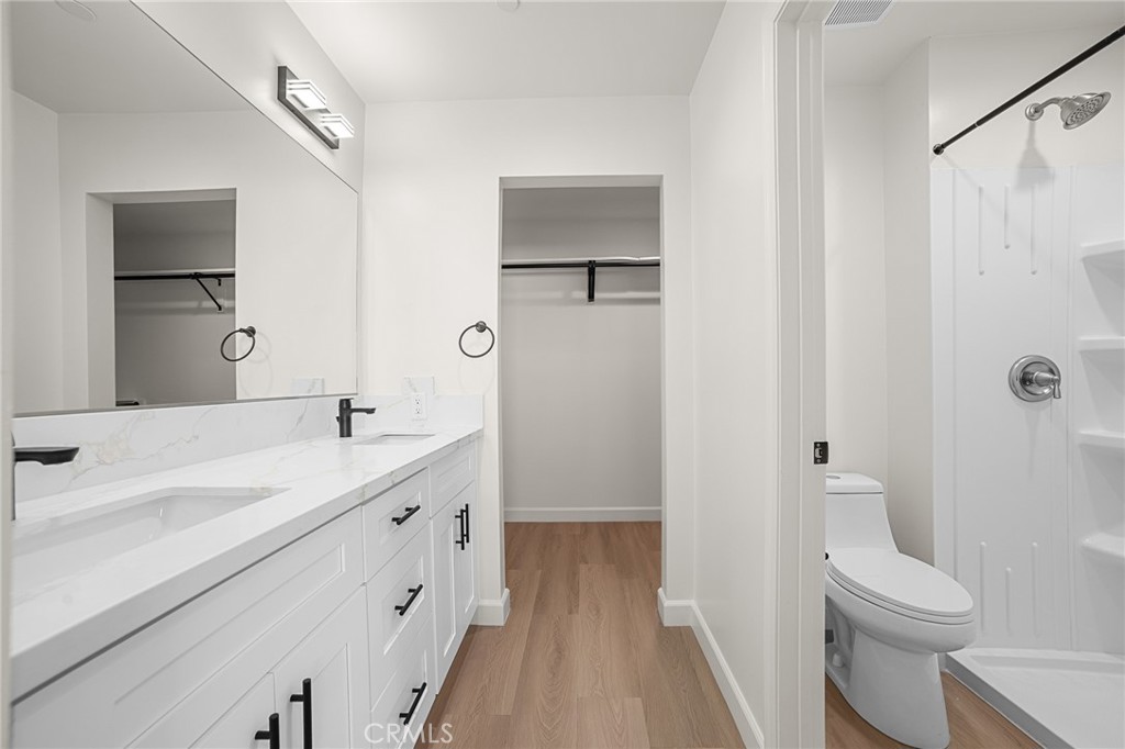 900 South Hert Street Colton, CA 92324 - Photo 12 of 26 a bathroom with a sink a toilet and shower