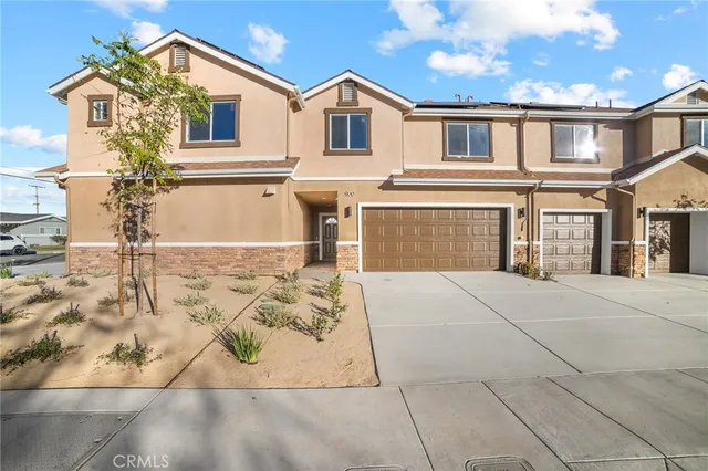 a front view of a house with parking