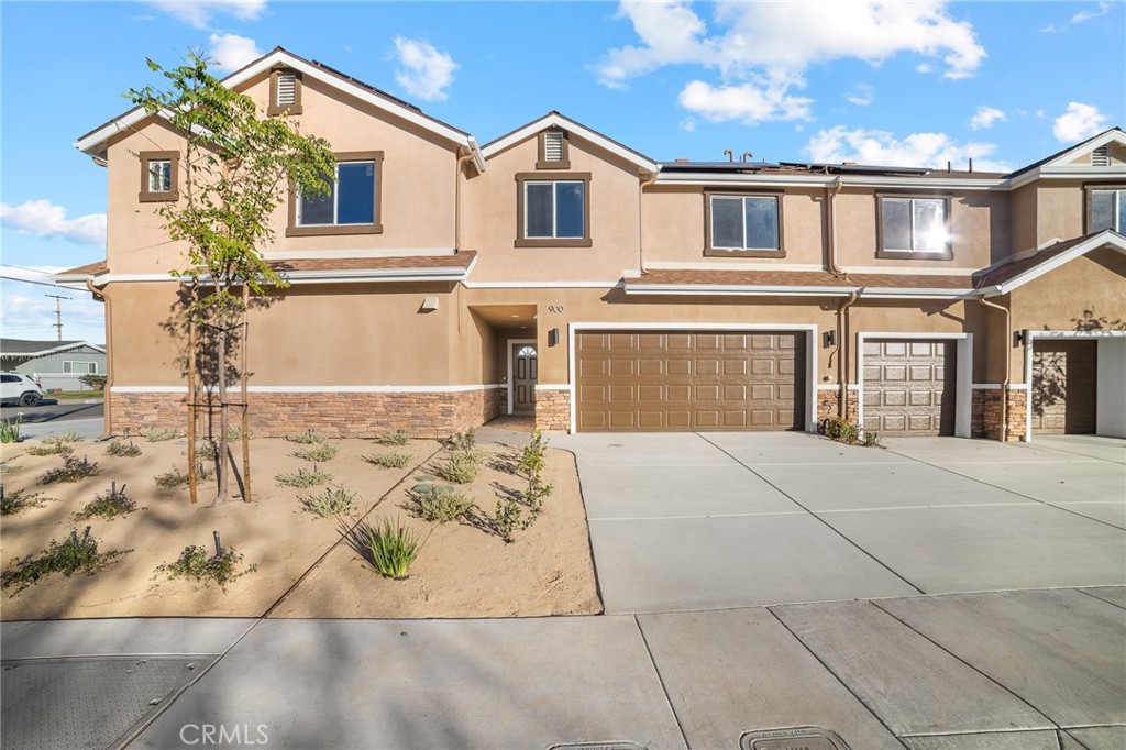 900 South Hert Street Colton, CA 92324 - Photo 24 of 26 a front view of a house with a yard