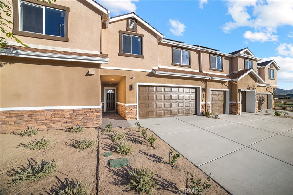 900 South Hert Street Colton, CA 92324 - Photo 25 of 26 a front view of a house with parking