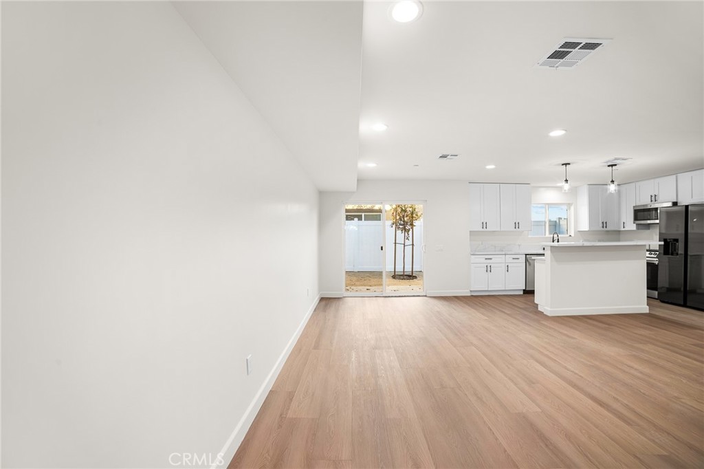 900 South Hert Street Colton, CA 92324 - Photo 3 of 26 a view of a kitchen with a sink and cabinets