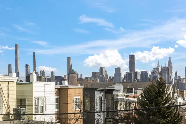 a view of a city with tall buildings