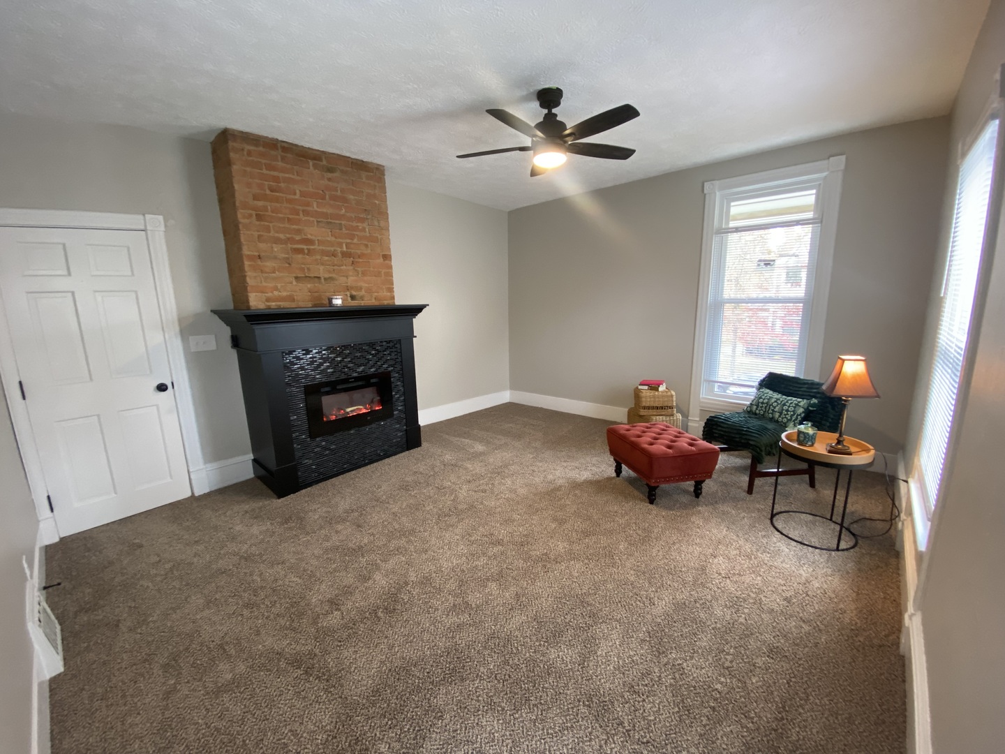 612 1/2 East Chestnut Street, Unit 2 Bloomington, IL 61701 - Photo 2 of 8 a living room with furniture and a fireplace