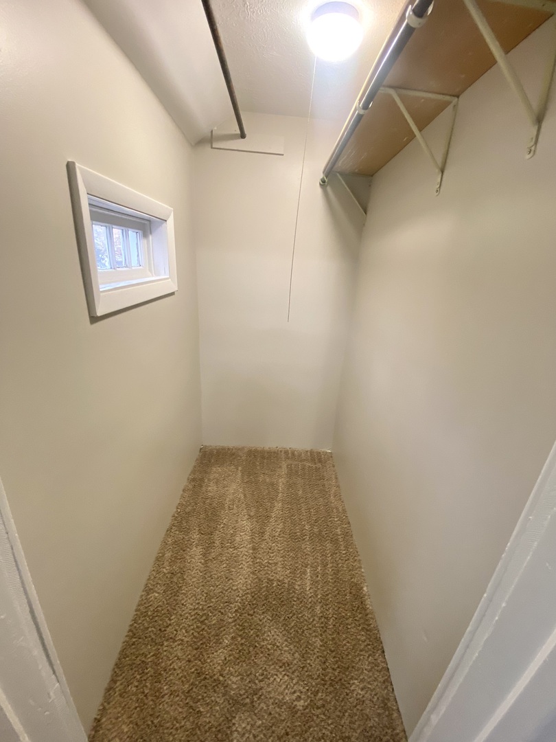 612 1/2 East Chestnut Street, Unit 2 Bloomington, IL 61701 - Photo 8 of 8 a view of small space with racks on the wall