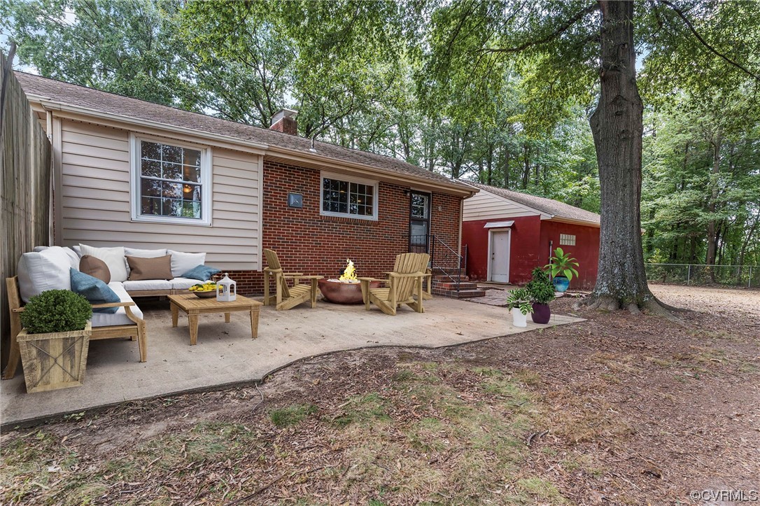 5512 Raleigh Road Henrico, VA 23231 - Photo 6 of 26 Back of property featuring a patio and an outdoor living space