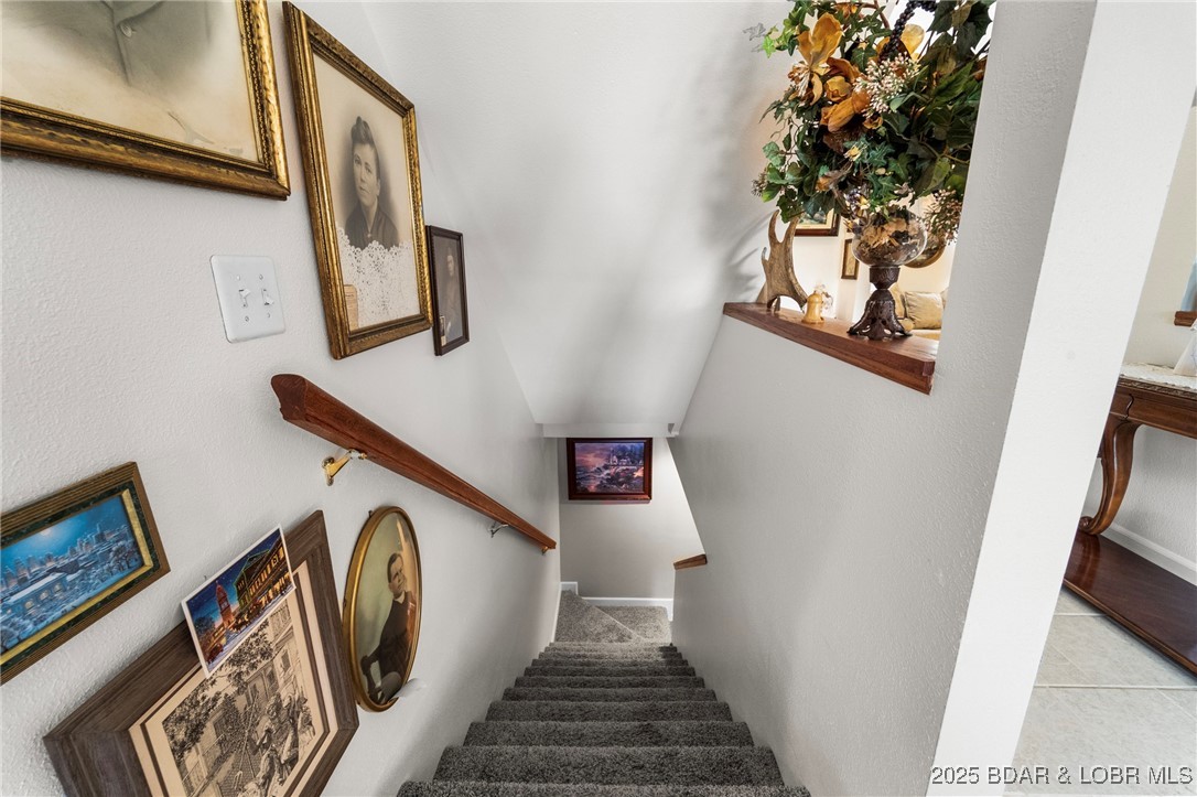 1008 South Beacon Ridge Lake Ozark, MO 65049 - Photo 33 of 50 Stairway to lower level