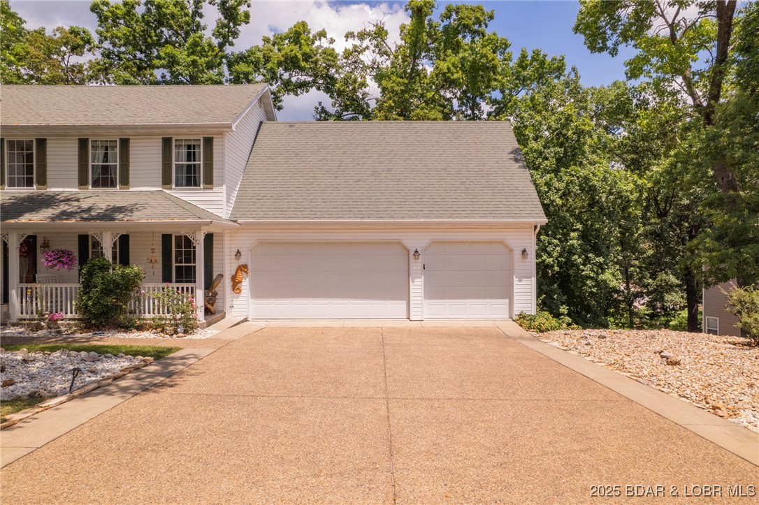 1008 South Beacon Ridge Lake Ozark, MO 65049 - Photo 43 of 50 3 car garage with plenty of parking