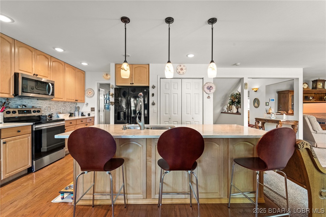 1008 South Beacon Ridge Lake Ozark, MO 65049 - Photo 6 of 50 Large kitchen island w/lovely pendant lighting