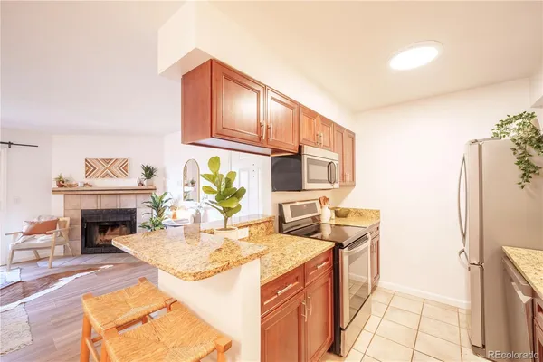 a kitchen with a stove and a refrigerator