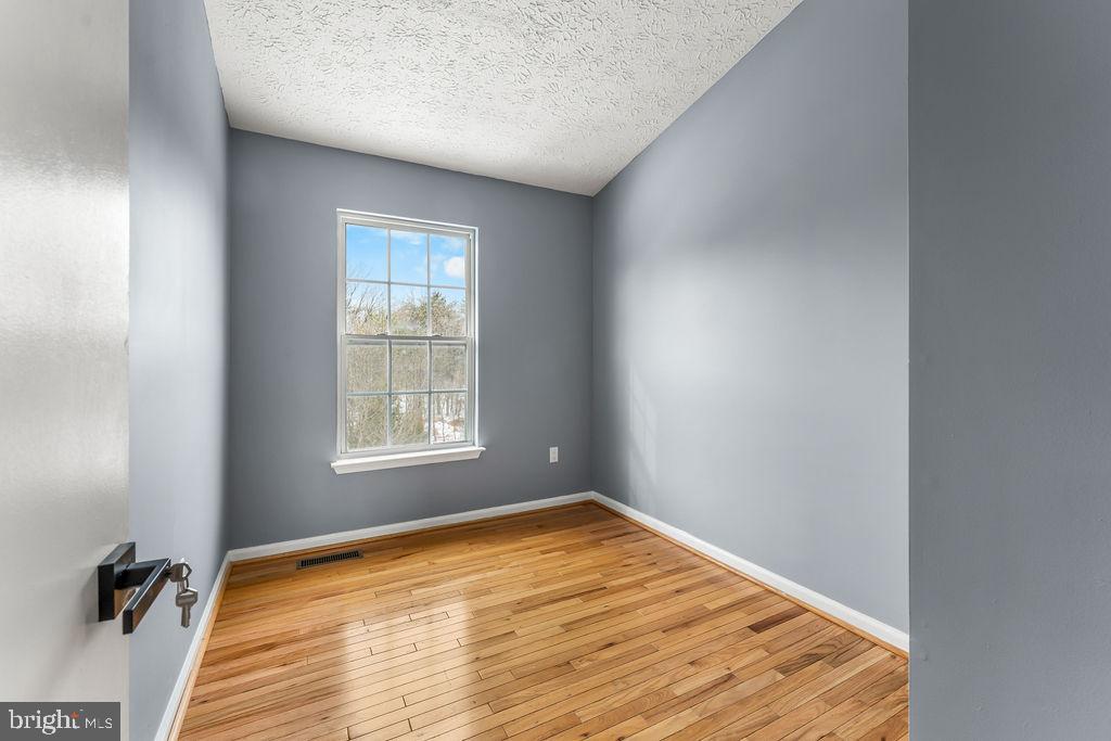 7711 Cornerstone Way Baltimore, MD 21244 - Photo 15 of 33 a view of a room with a window and wooden floor